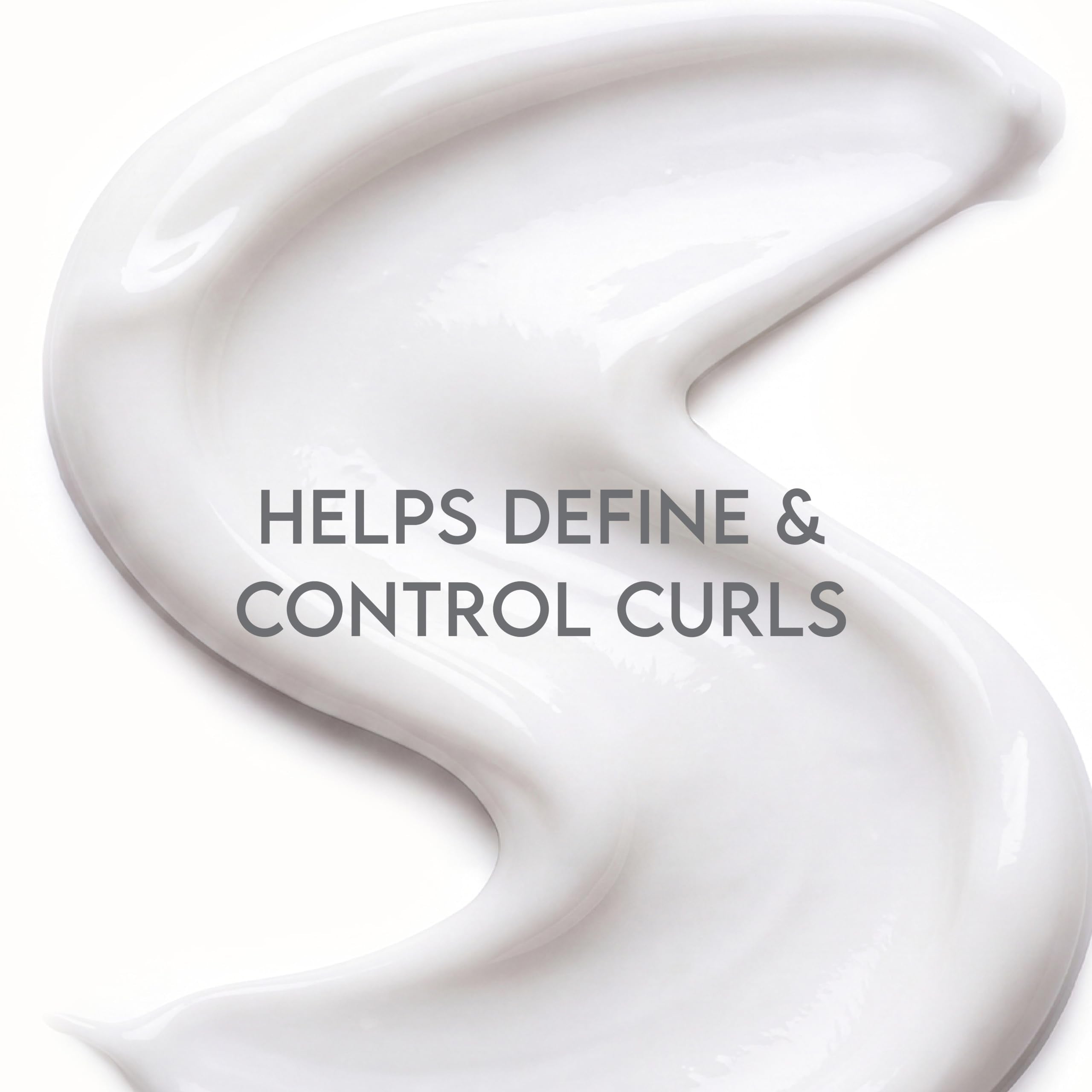 ALURAM being applied to damp hair to enhance curl definition and hold