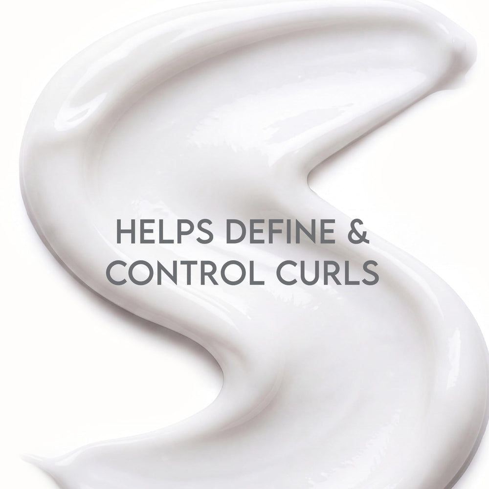 ALURAM being applied to damp hair to enhance curl definition and hold