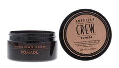 American Crew pomade being worked between hands for even distribution and control