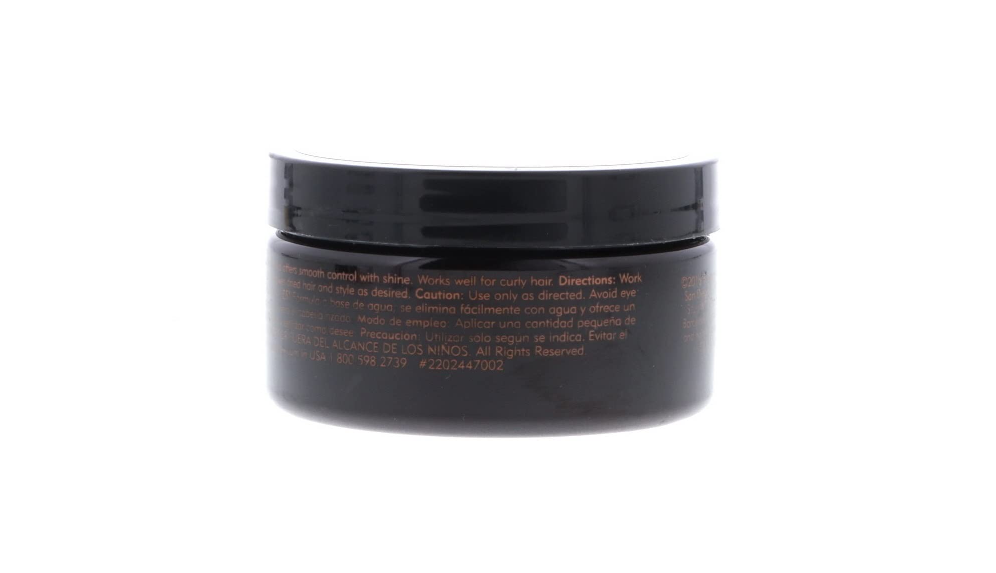 American Crew jar at barber station illustrating professional grooming results