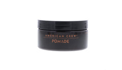 American Crew pomade on fingers ready to apply, aids precise styling