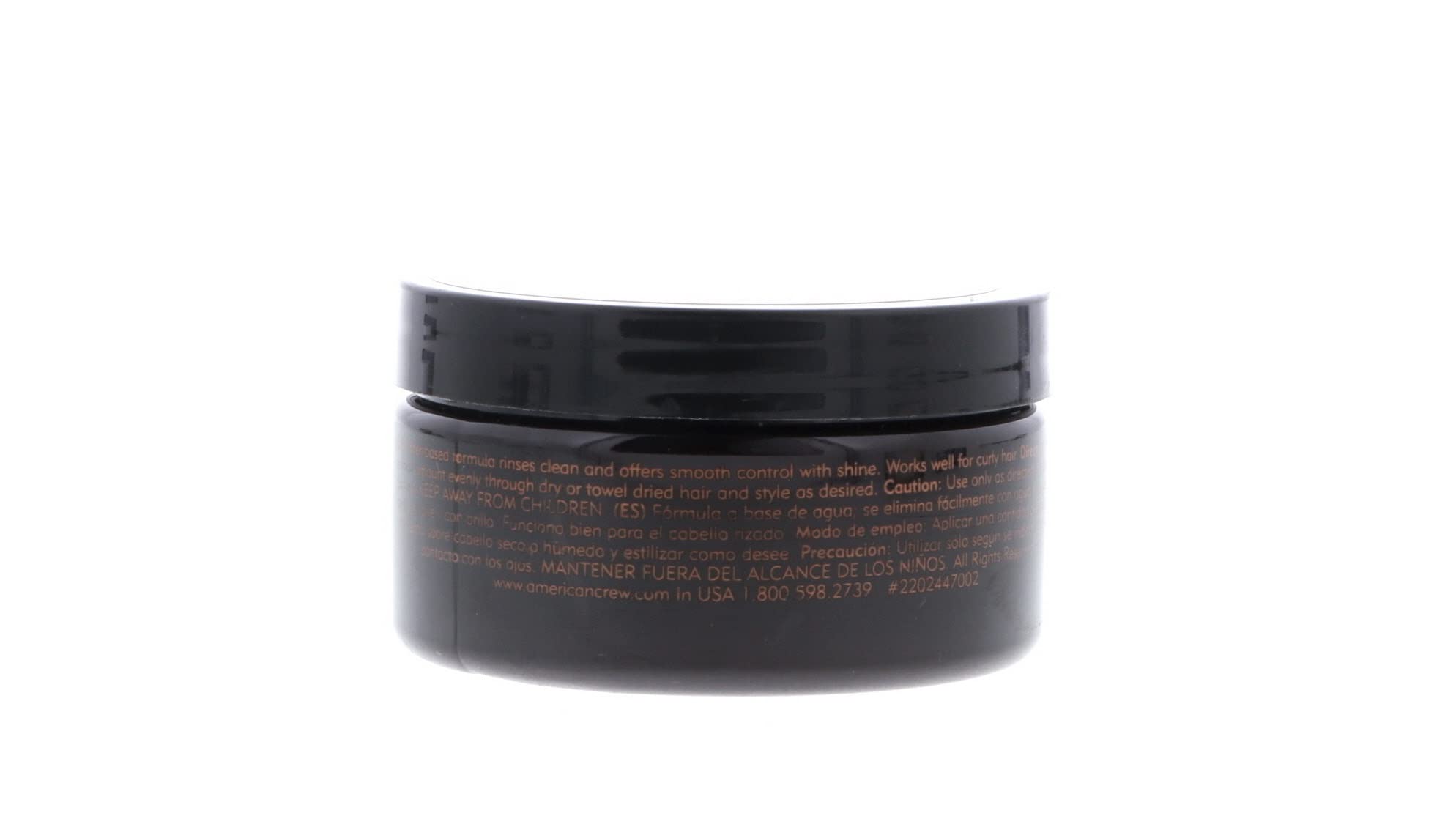 American Crew pomade next to hand for size comparison, ideal travel-friendly benefit