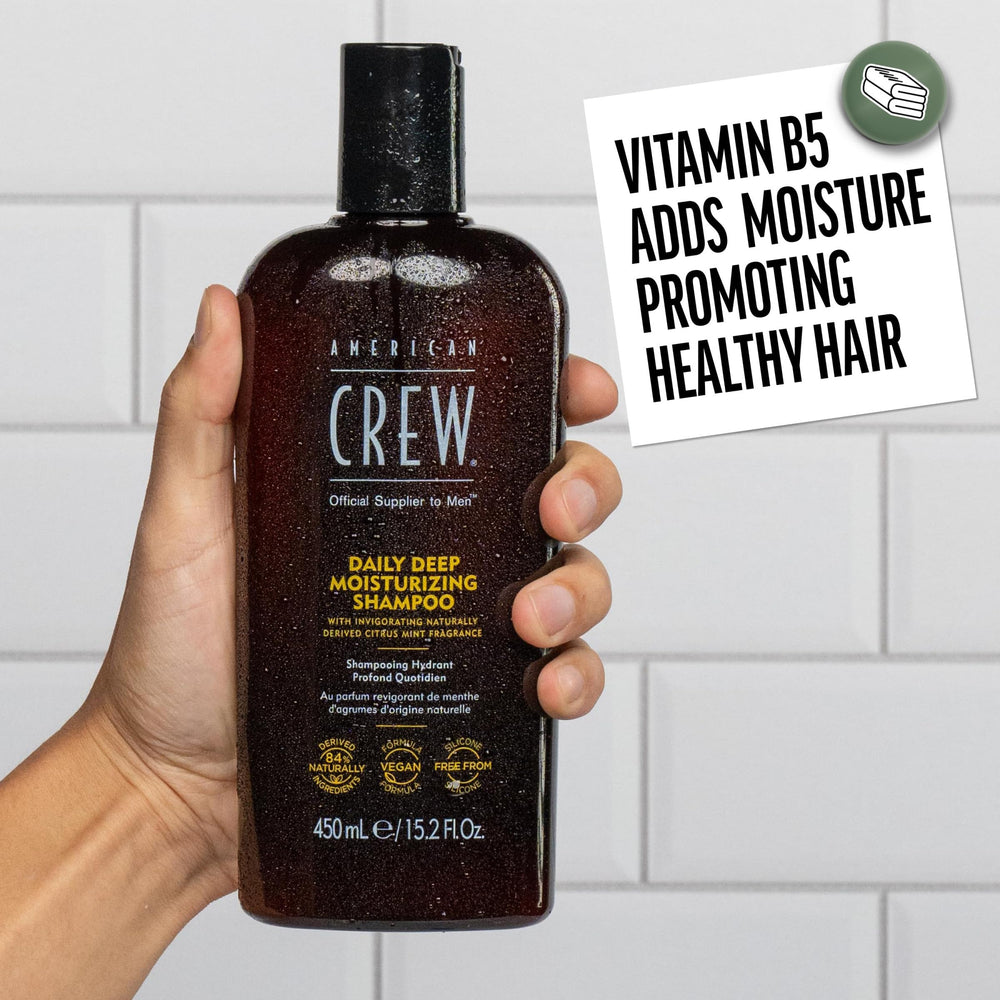 American Crew shampoo in hand during application demonstrating easy use and thorough rinse