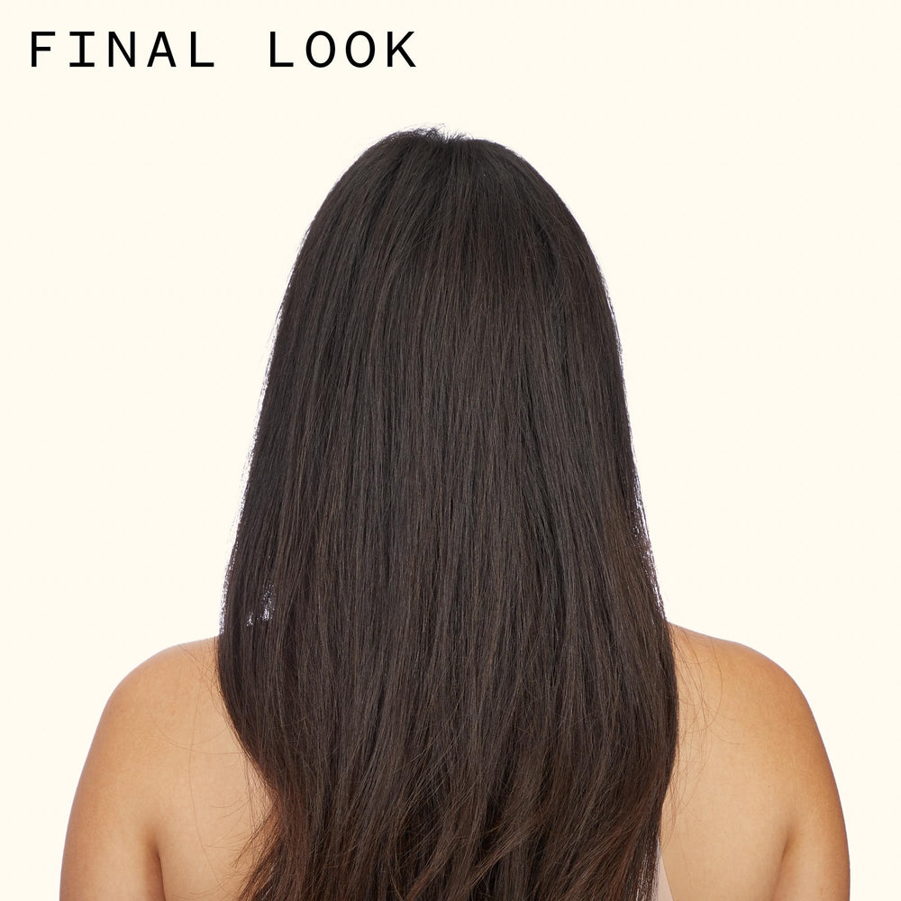 amika bottle on vanity styled with hair tools conveying salon-quality results