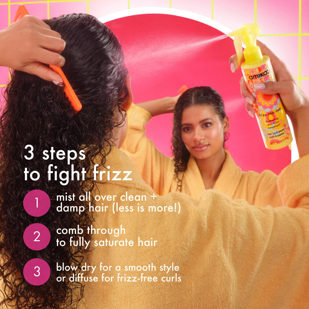 Amika being sprayed on damp hair for even distribution and better styling prep