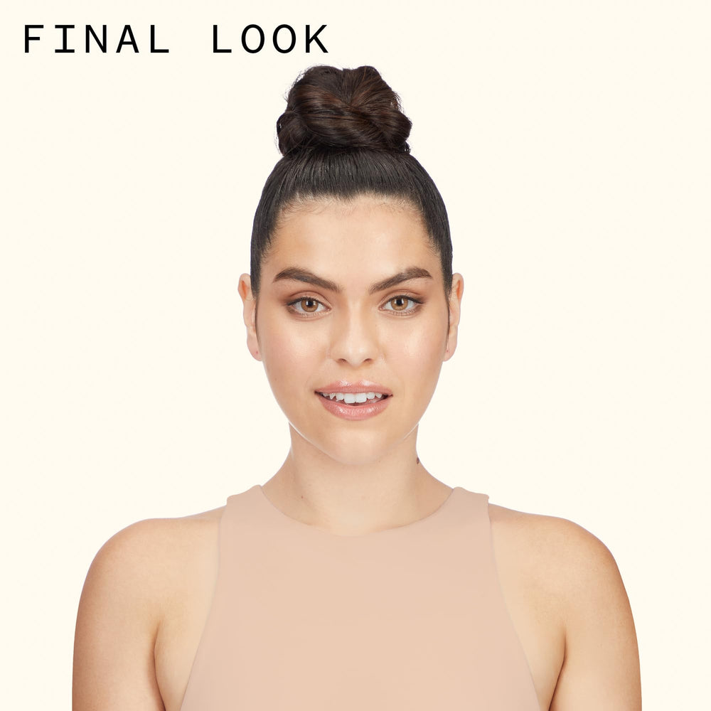 amika headstrong spray in use on an updo holding style firmly
