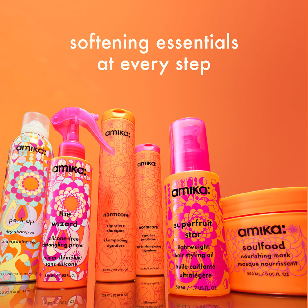 amika the wizard being sprayed into hand for easy pre-styling use