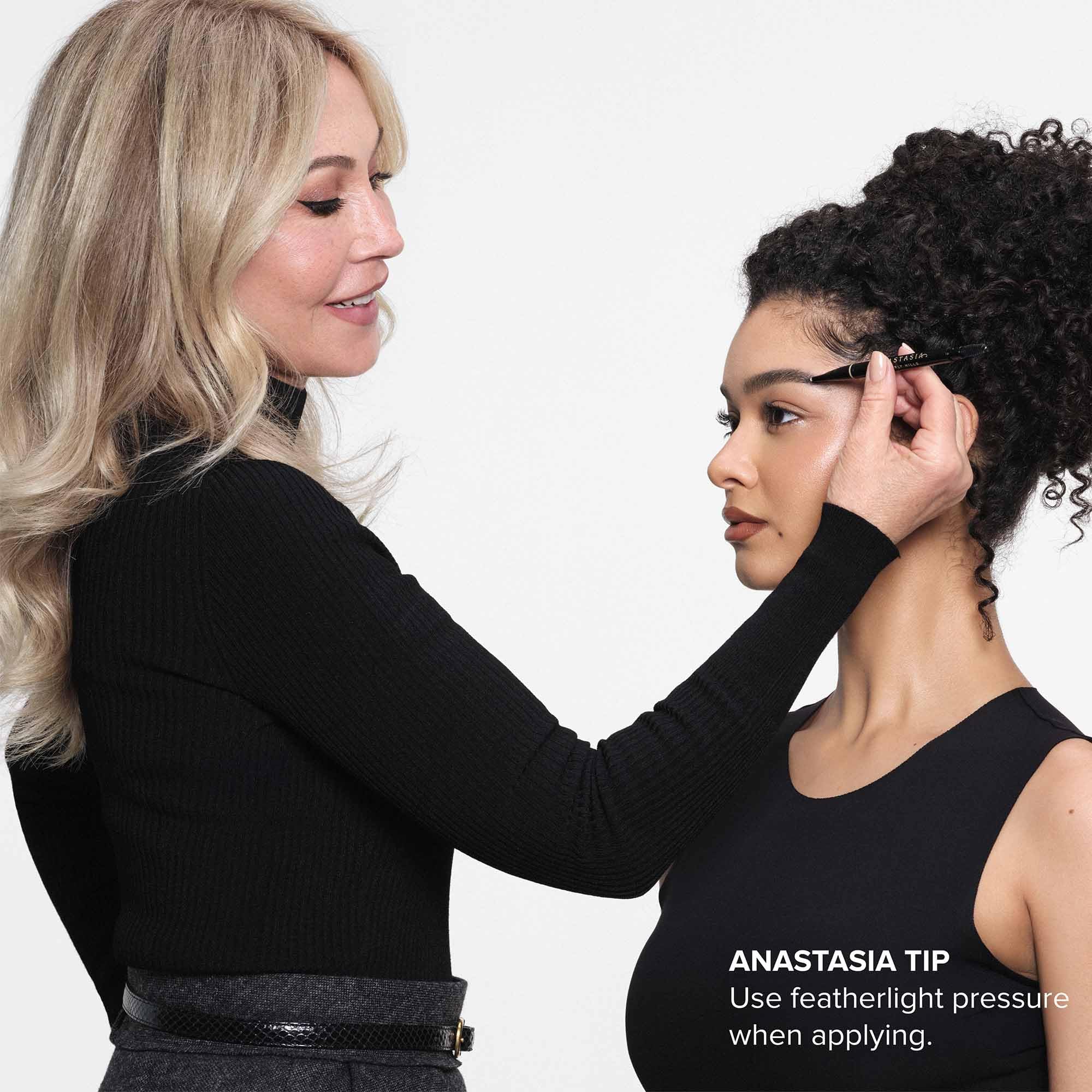 Anastasia Beverly Hills pencil held in hand showing compact scale and control