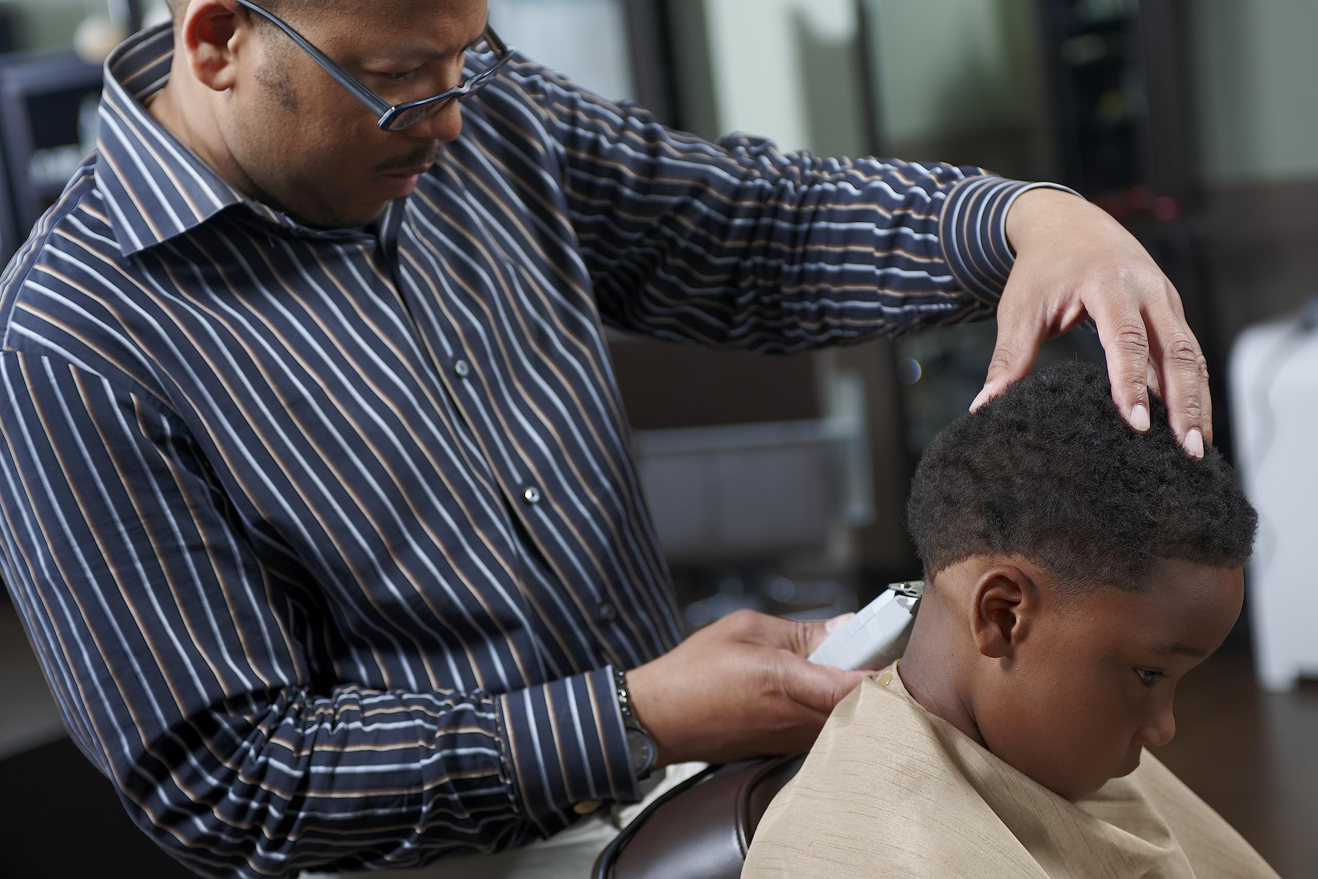 Andis combo in-use in barber setting showing efficient workflow and professional results