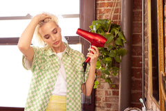 Andis concentrator attachment attached to nozzle for focused airflow control