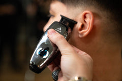 Andis GTX-EXO II black chrome close-up showing textured grip and ergonomic design benefit: comfortable control