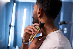 Andis trimmer in use shaping a beard to demonstrate precise outlining benefit