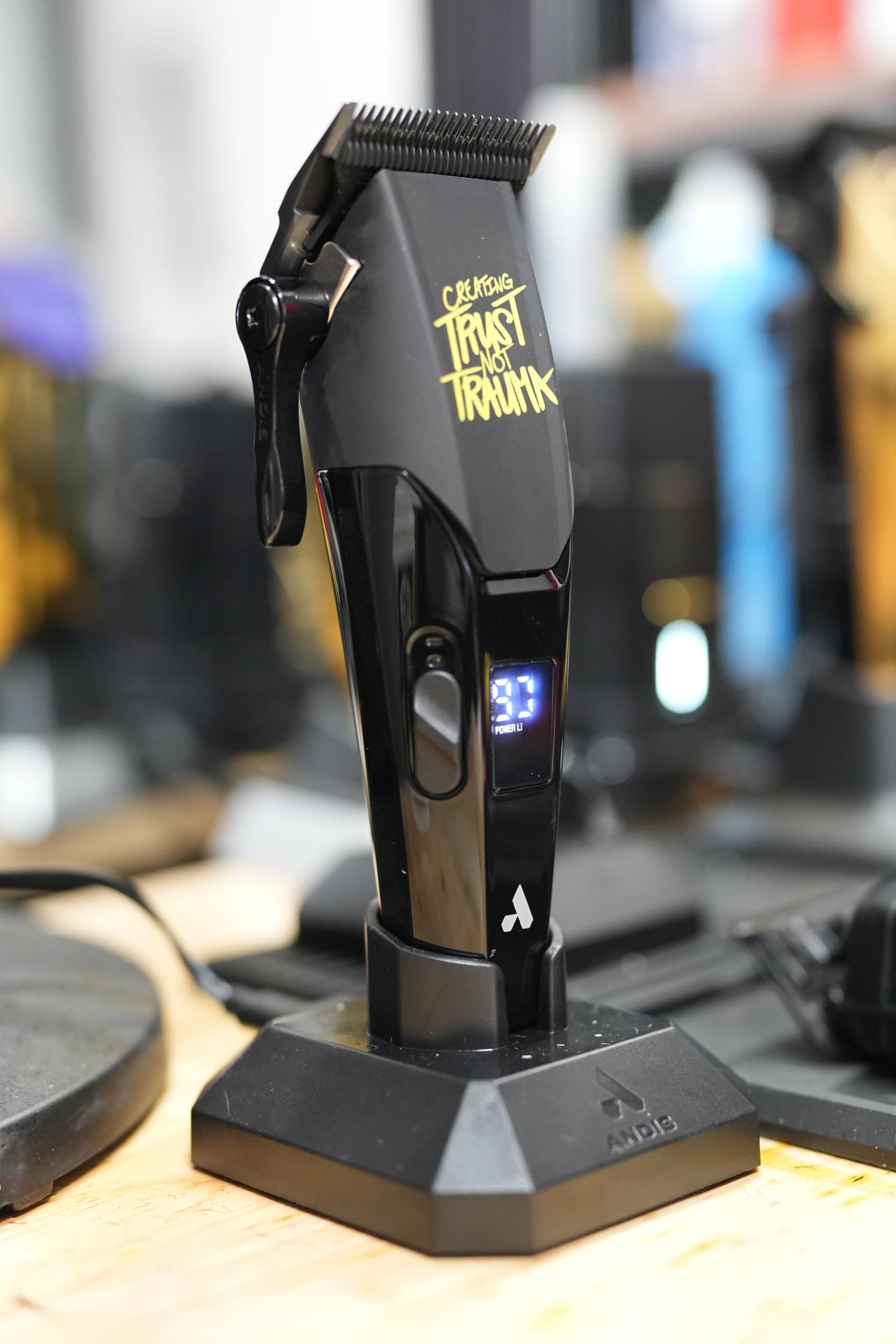 Andis Zephyr on charging stand with USB-C cord for reliable two-hour runtime