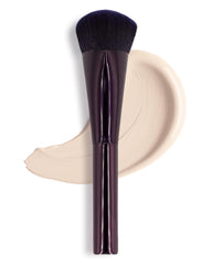 ANISA BEAUTY front view of compact Pinnacle brush showing packaging and portability benefit