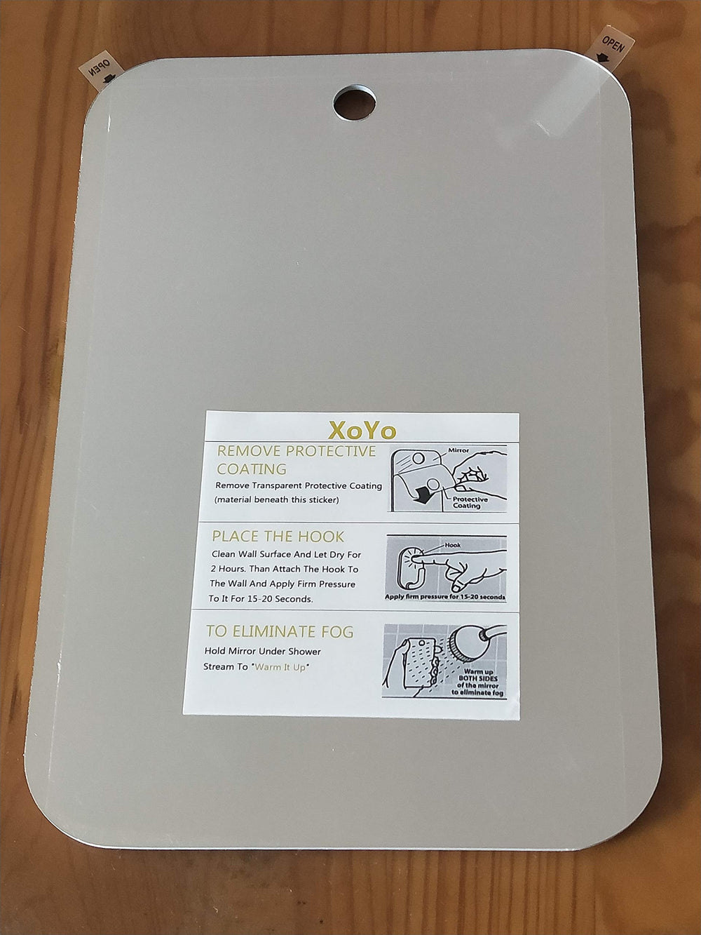 APHUIME boxed mirror with hook and protective film showing ready-to-install accessories