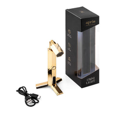 APRÉS Omni Light front view showing compact gold lamp and controls for portable curing