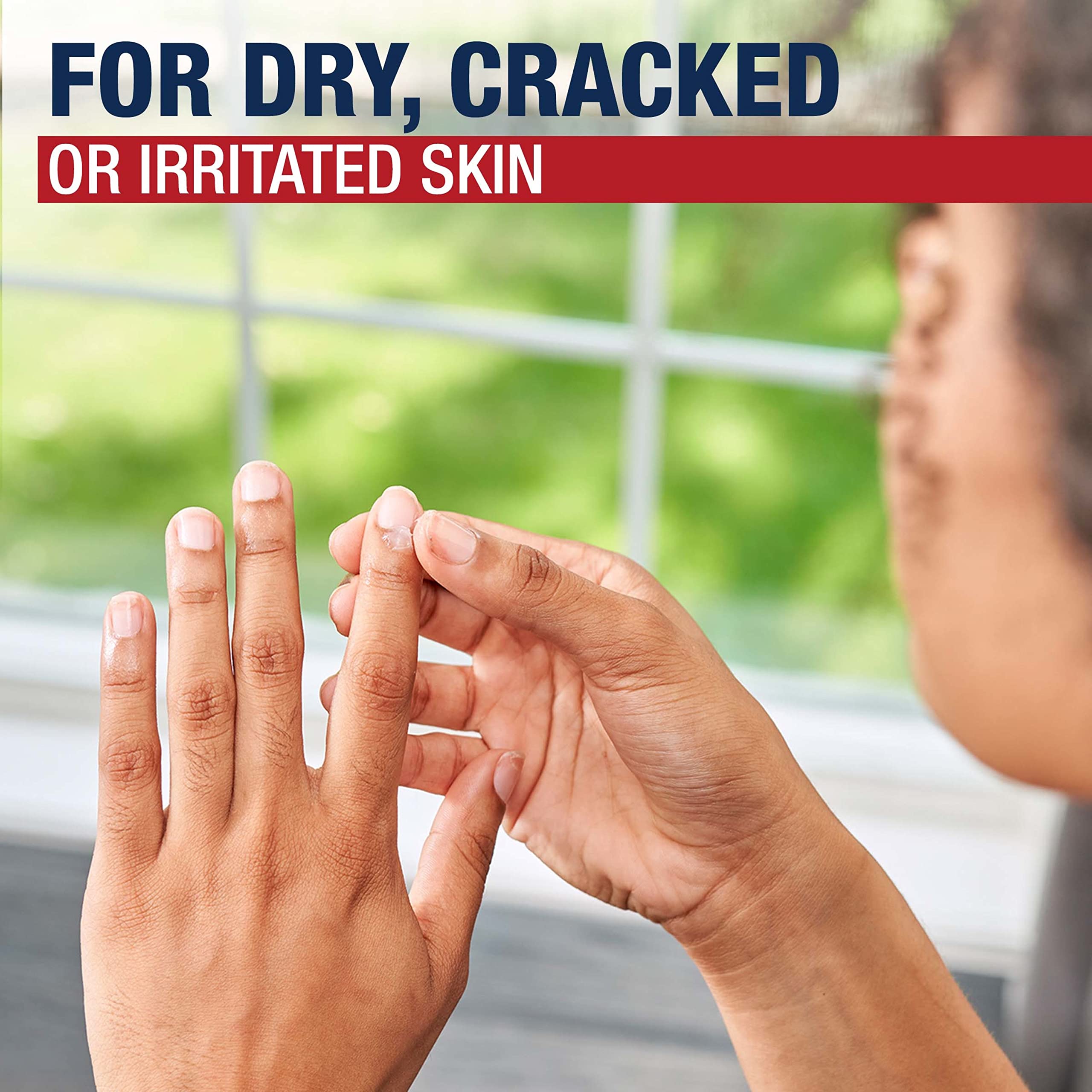 Aquaphor being applied to hands to soften cuticles and dry skin