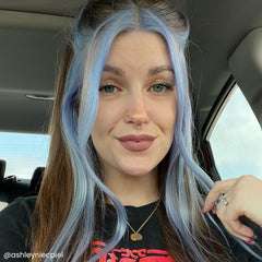 ARCTIC FOX periwinkle strand swatch on blonde hair showing pastel lavender-blue payoff