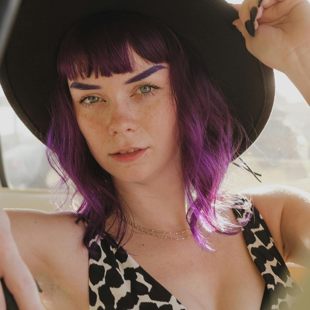ARCTIC FOX before-and-after on blonde hair showing vibrant purple result