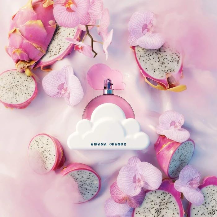Ariana Grande Cloud Pink travel spray held in hand, convenient for carrying