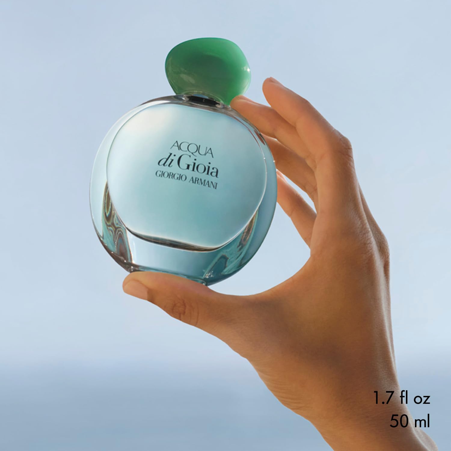 Armani Beauty spray in action releasing a fine mist for even application and freshness