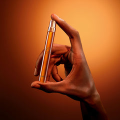 Armani Beauty travel spray being applied for quick on-the-go fragrance boost