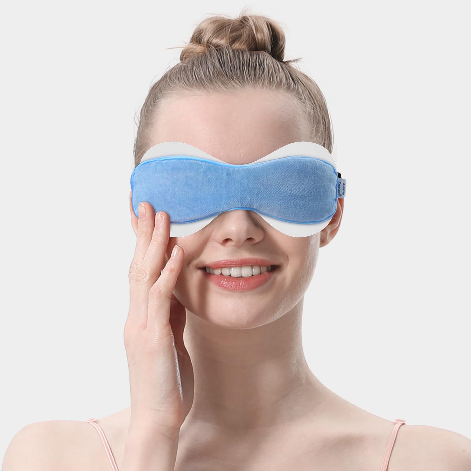 Aroma Season eyelid sheet placed inside heated eye mask showing proper fit