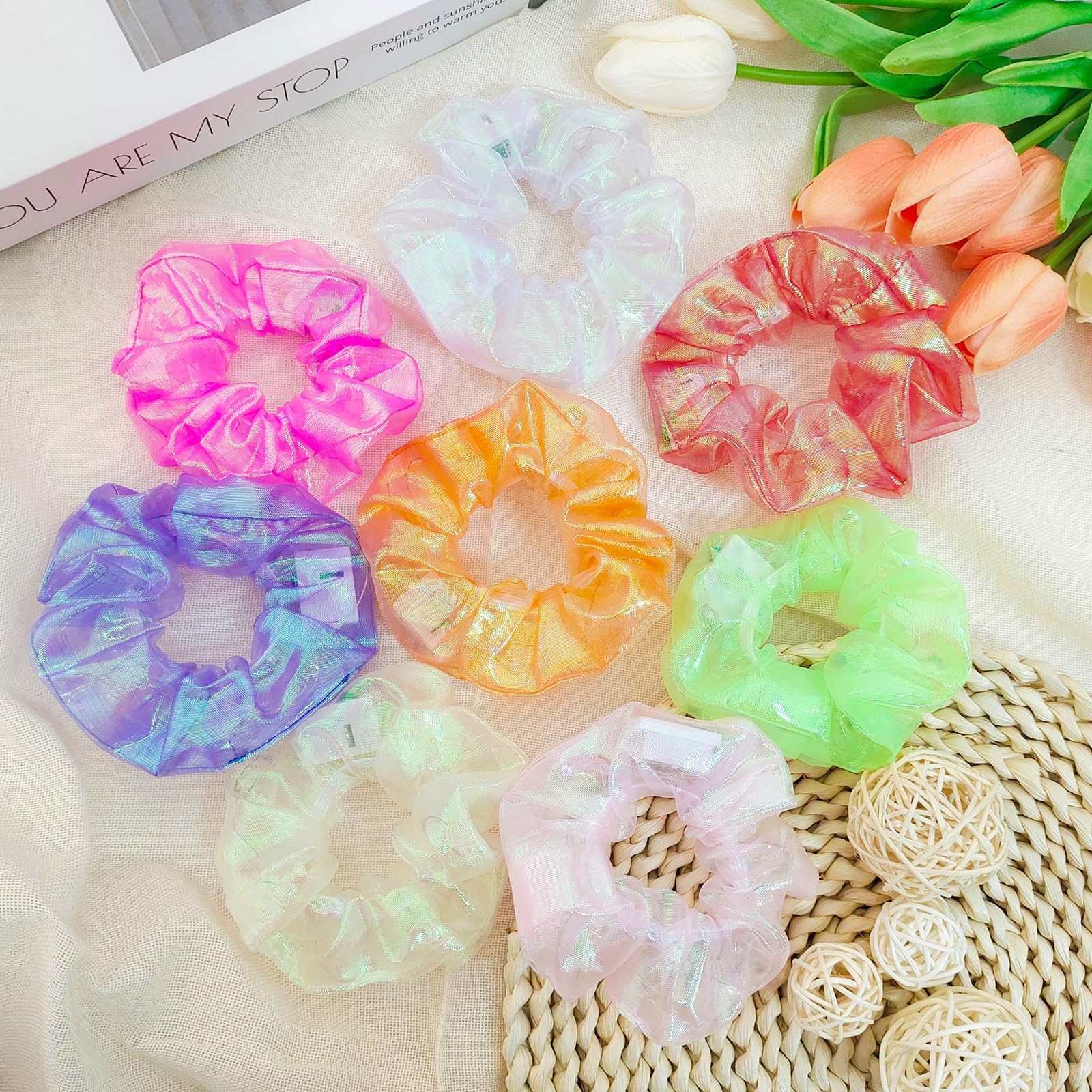 Asawira scrunchie size comparison next to a hand showing scale and fit