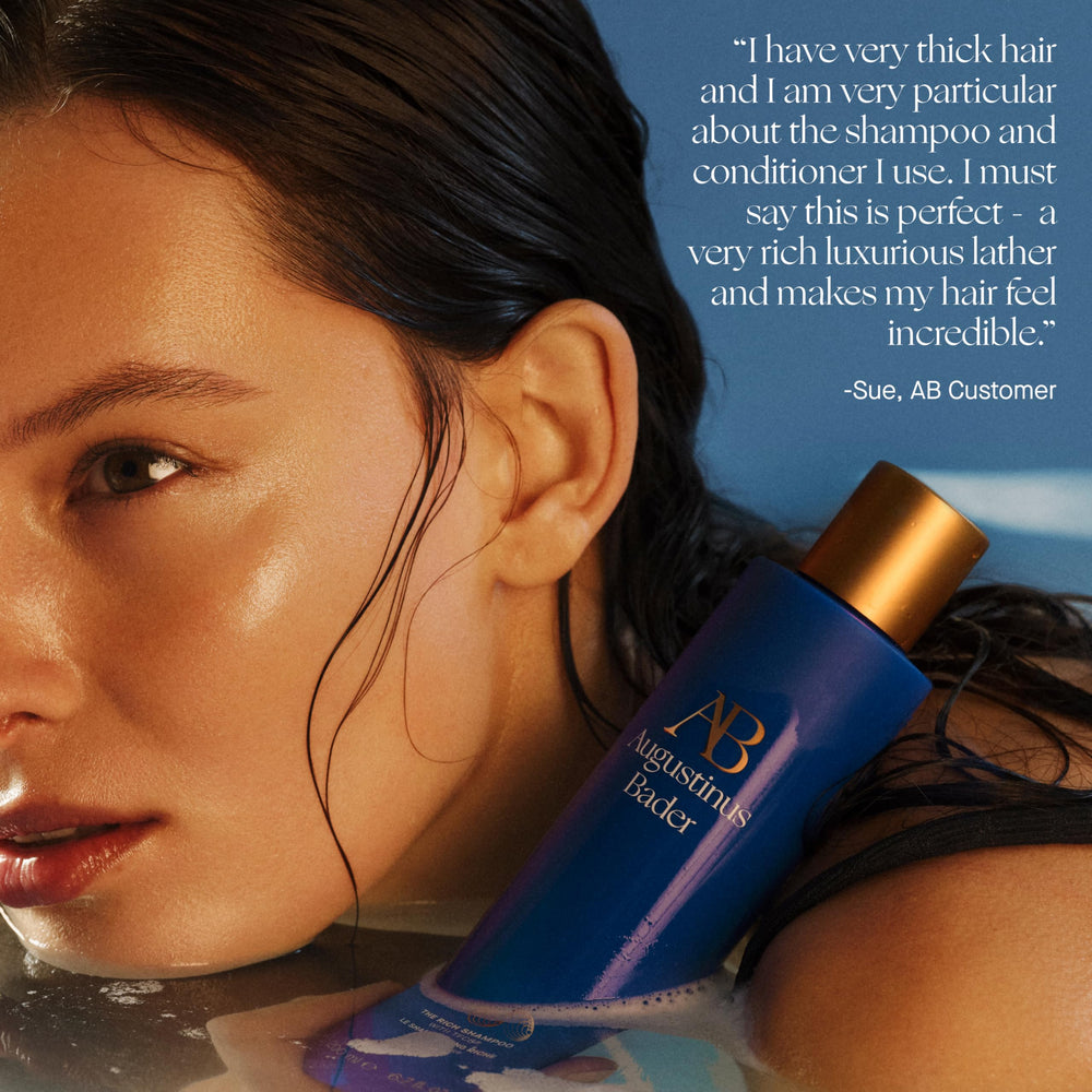 Augustinus Bader shampoo in bathroom lifestyle scene suggesting luxury routine benefit