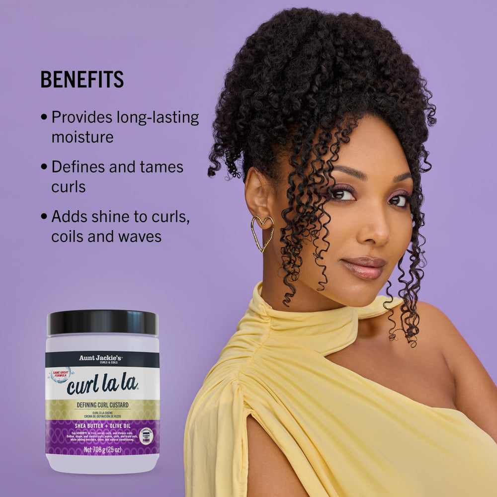 Aunt Jackie's applying product to wet hair for defined, frizz-free curls