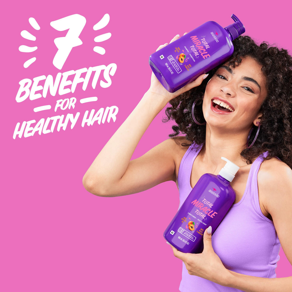 Aussie shampoo lather in hand demonstrating gentle cleansing action