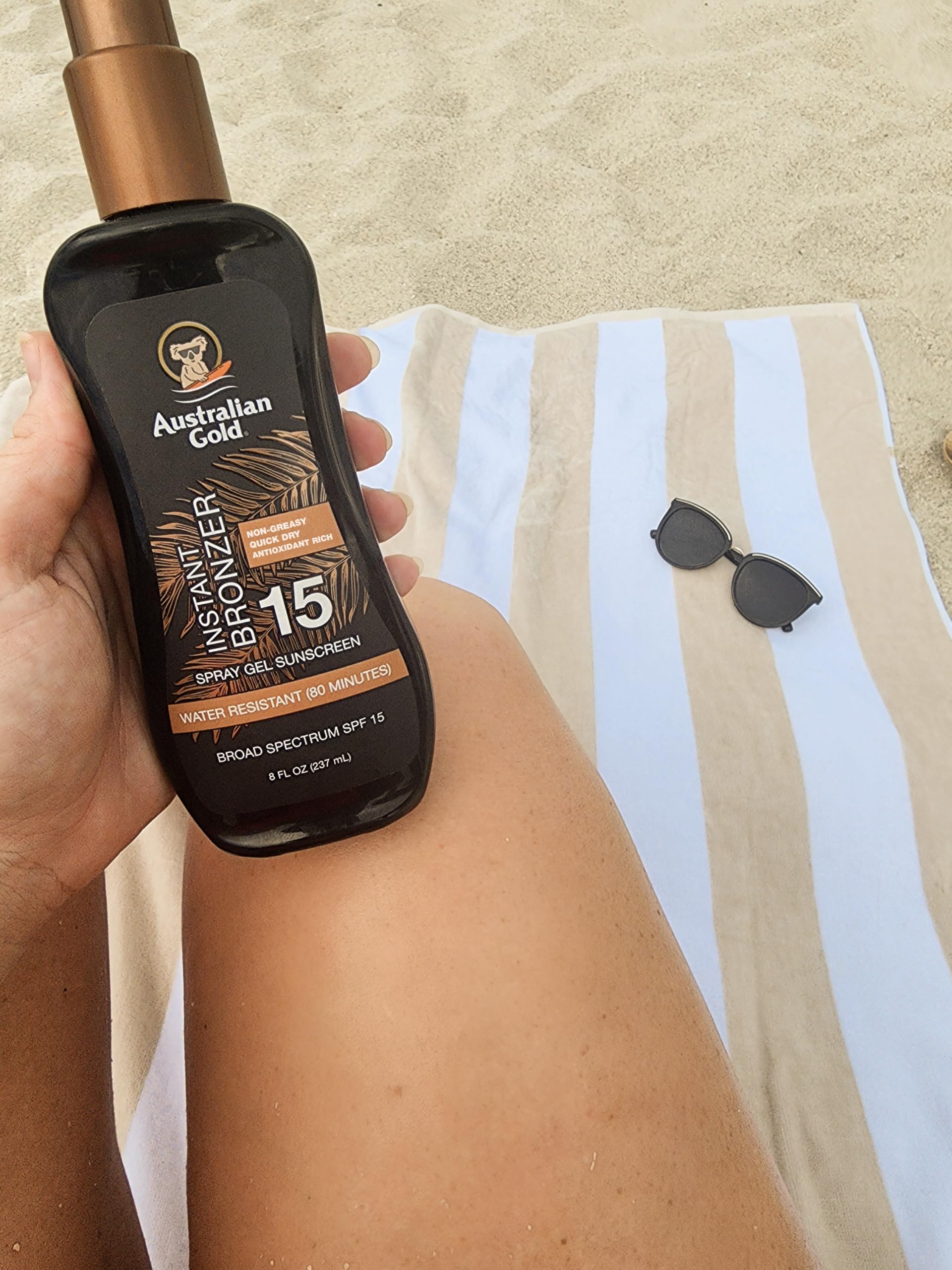 Australian Gold bottle tucked in a beach bag showing travel-ready convenience