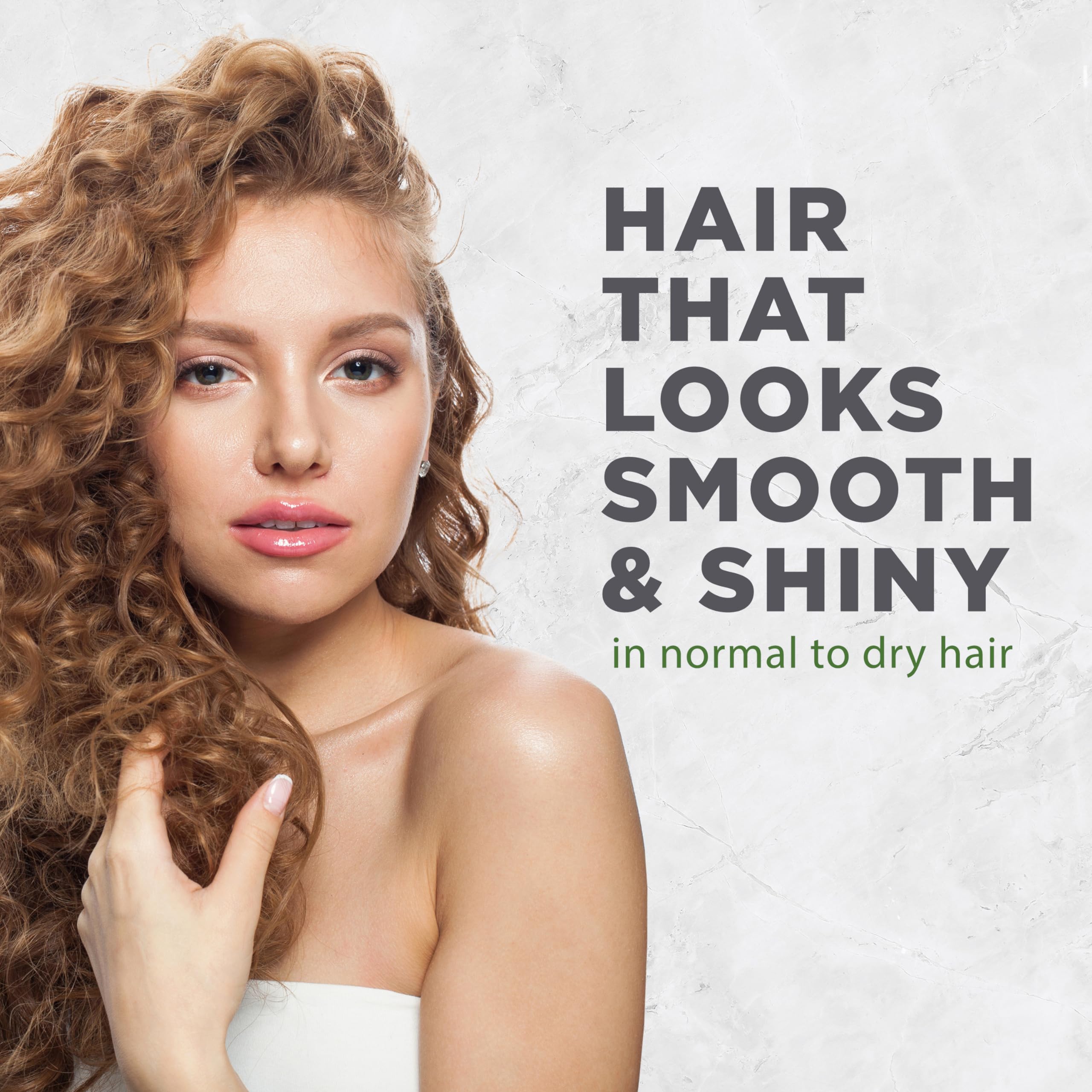 Avalon Organics conditioner dispensed in hand demonstrating smooth application benefit