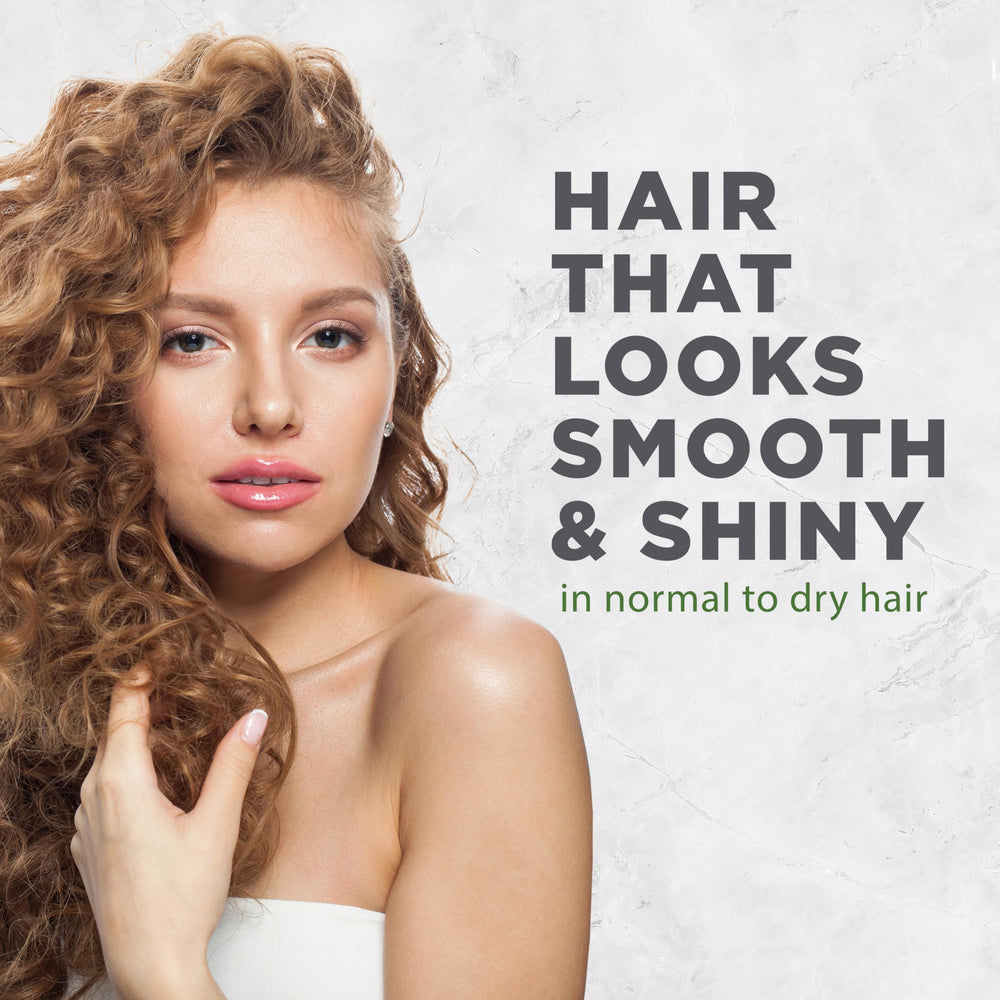 Avalon Organics conditioner dispensed in hand demonstrating smooth application benefit