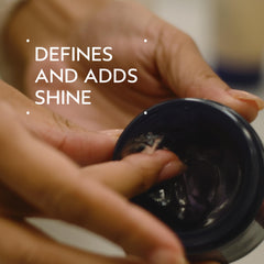 AVEDA pomade texture in open jar highlighting creamy formula for smooth application