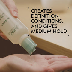 AVEDA Confixor pump dispenser close-up for easy use and precise application benefit
