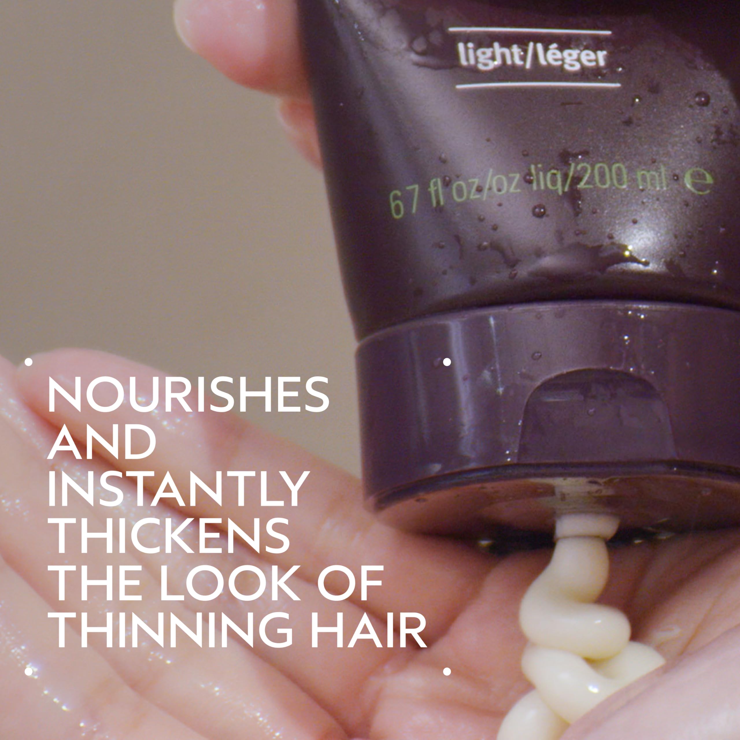 AVEDA pump dispenser detail on conditioner for easy dosing and cleaner use