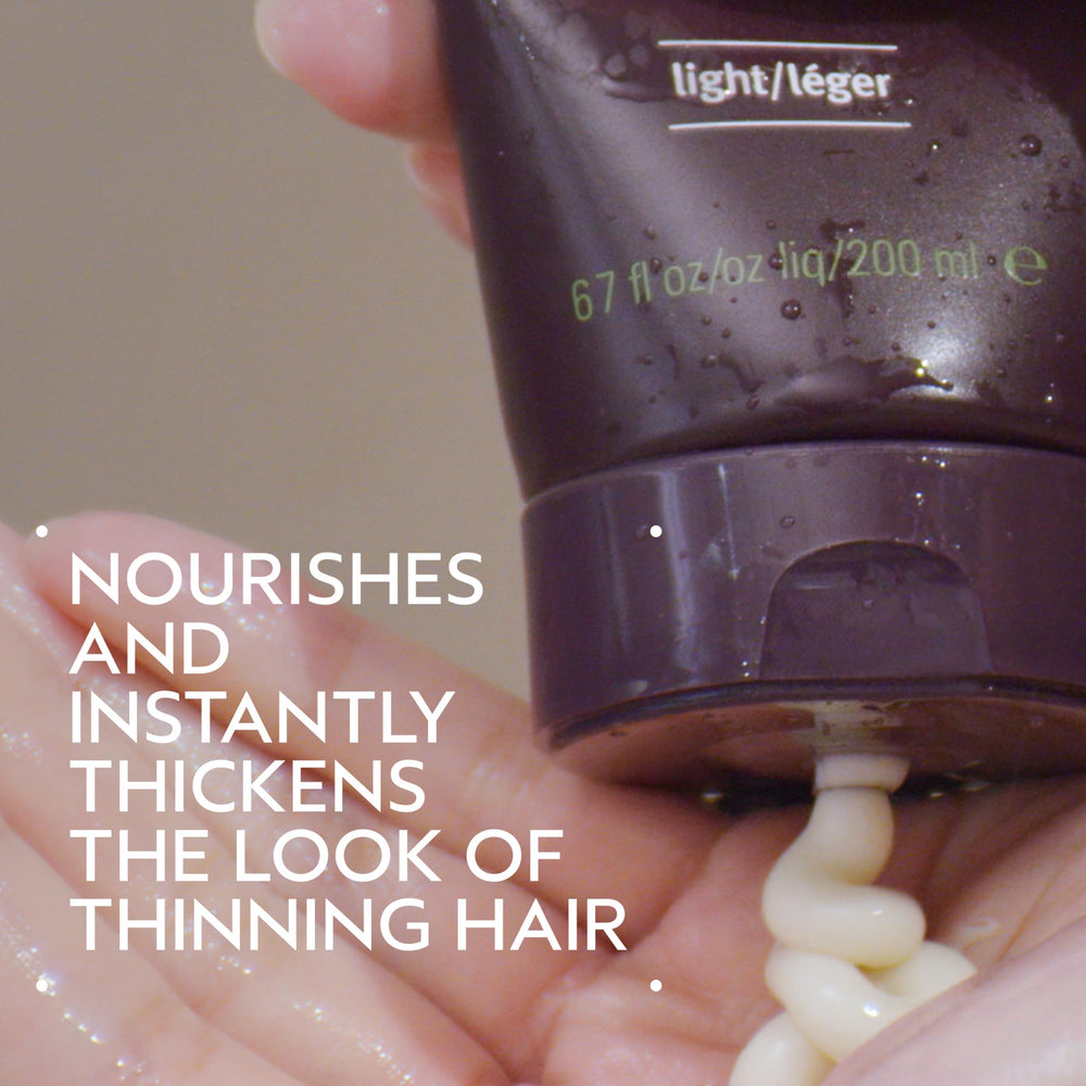 AVEDA pump dispenser detail on conditioner for easy dosing and cleaner use