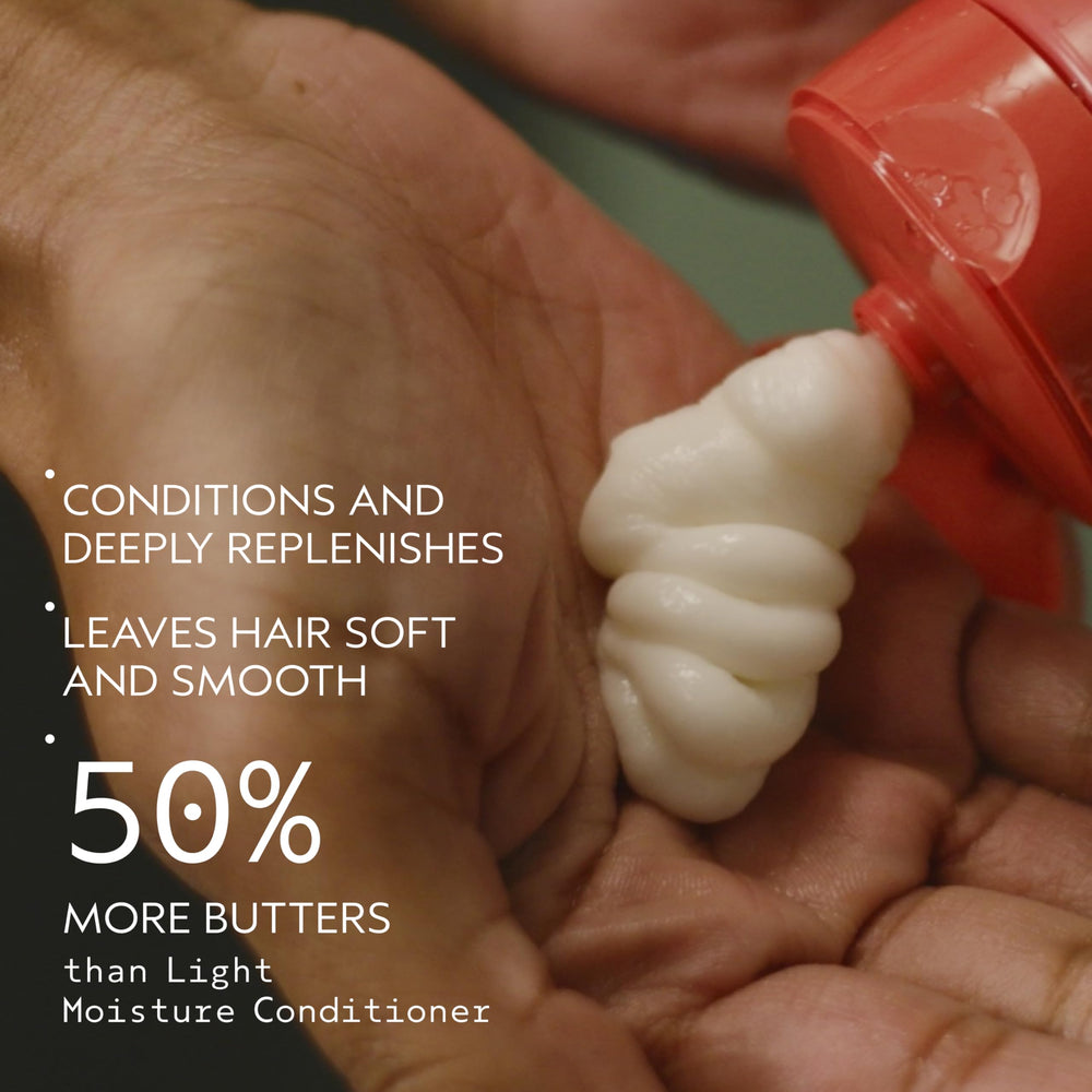 AVEDA creamy conditioner texture on spoon demonstrating rich moisturizing feel