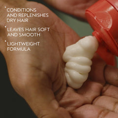 AVEDA creamy conditioner texture on palm showing smooth lightweight hydration benefit
