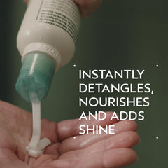 AVEDA cream texture close-up illustrating smooth formula for detangling