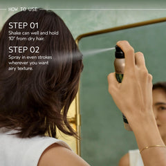 AVEDA Tousle Texture spray in hand demonstrating lightweight mist