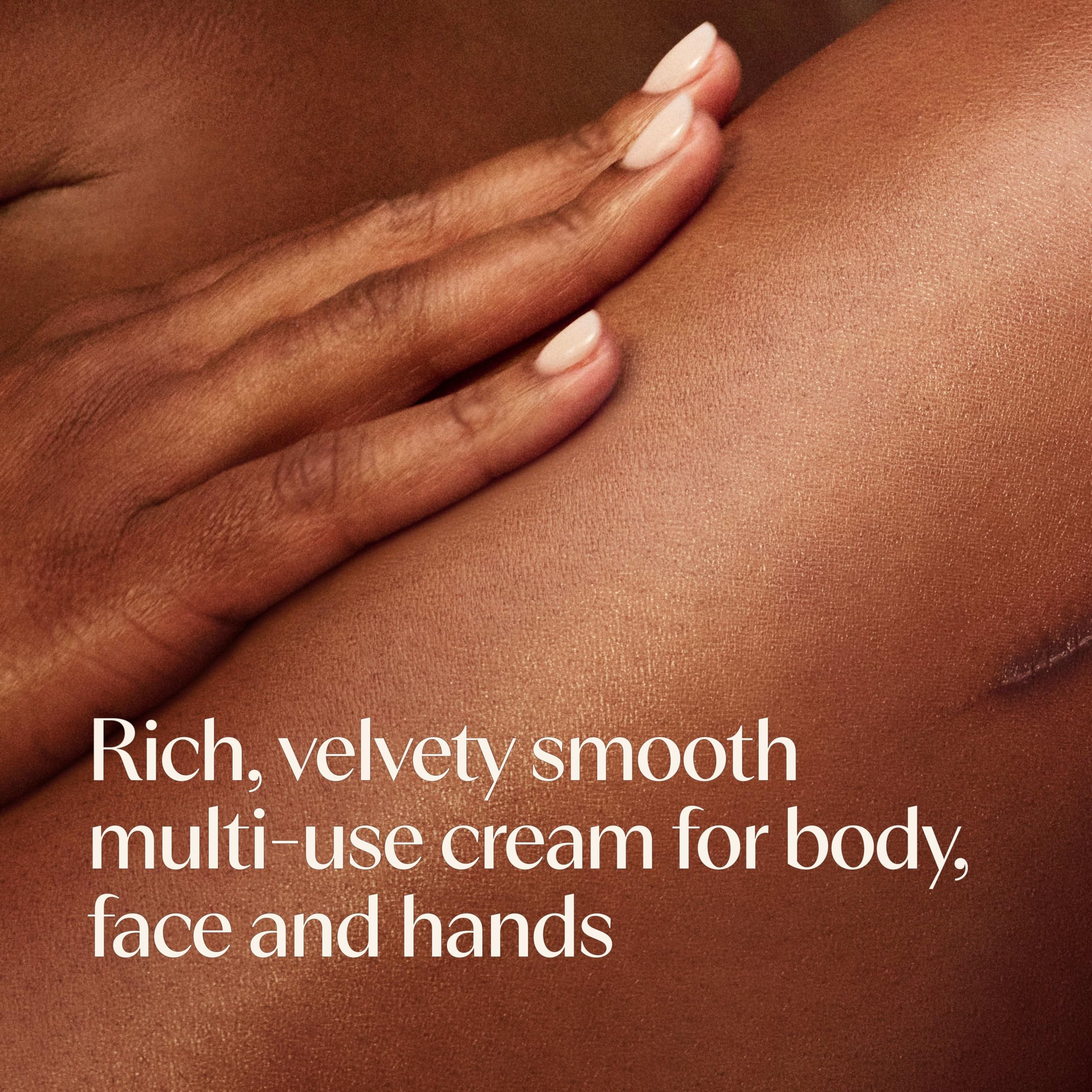 Hand applying Aveeno cream to dry skin for instant soothing hydration