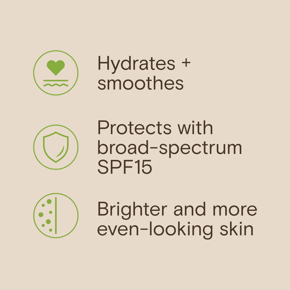 Aveeno tube held in hand to show 2.3 fl oz travel-friendly size