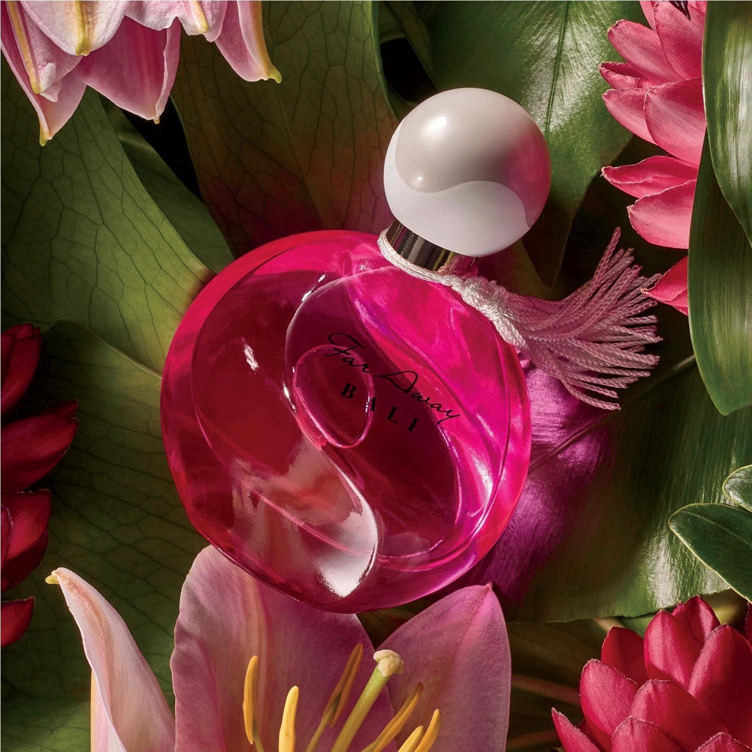 AVON bottle staged on a sandy beach to evoke Bali warmth and mood benefit sensory escape