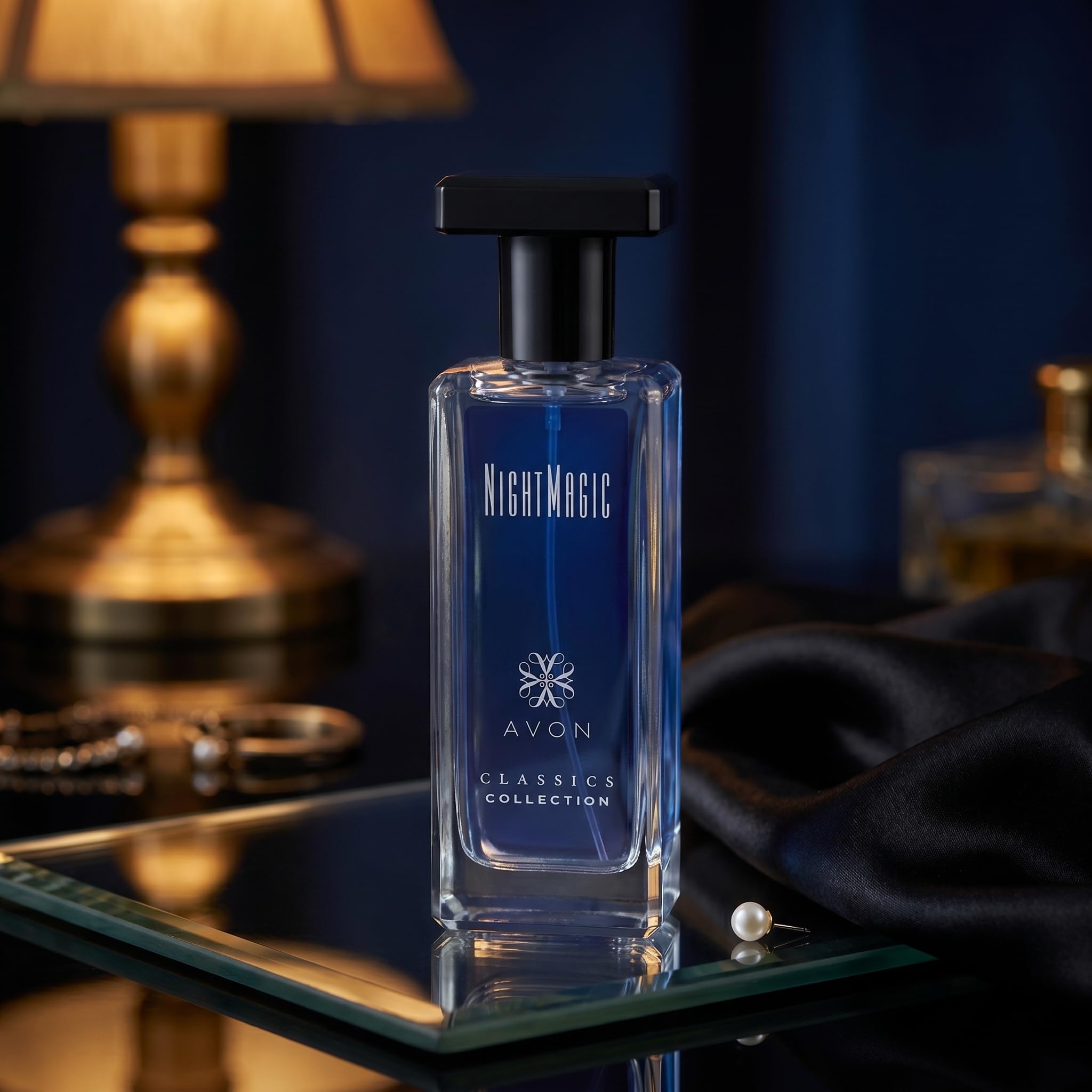 AVON Night Magic ingredient-inspired still life evoking floral-woody fragrance notes benefit