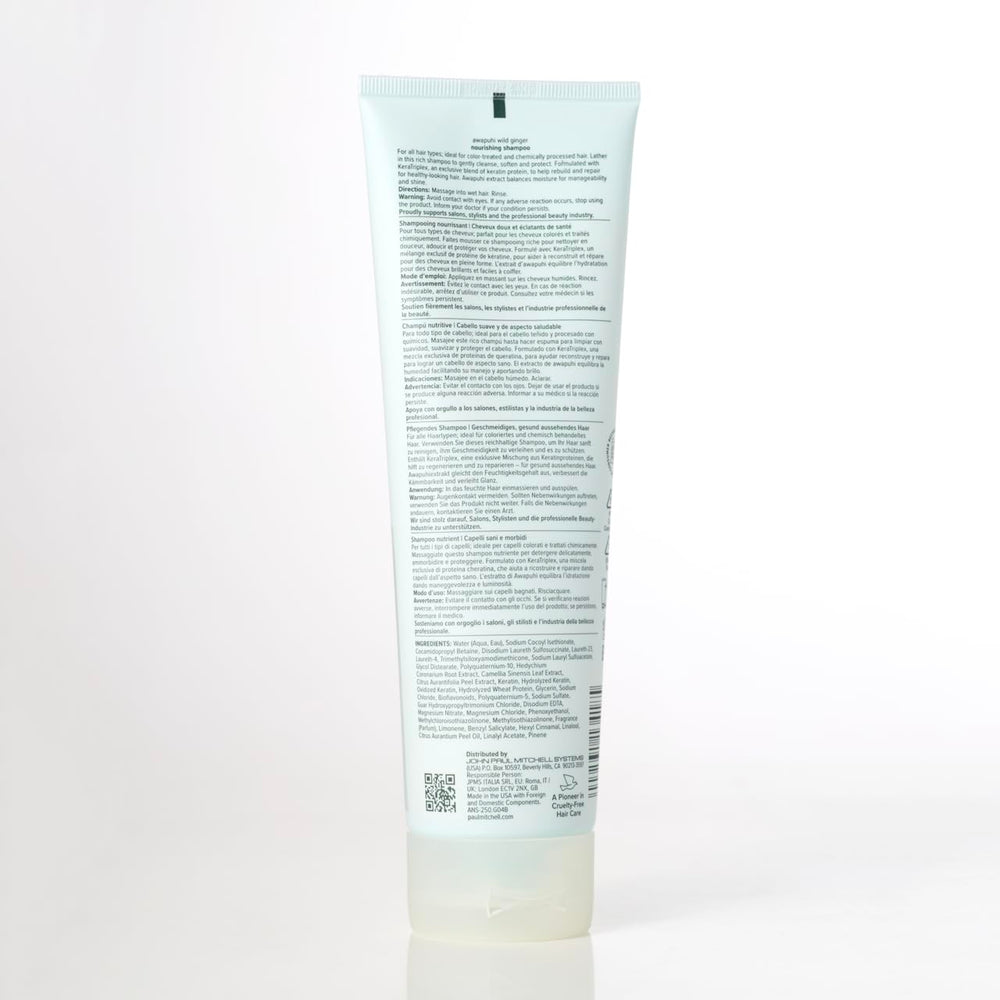 Awapuhi Wild Ginger bottle beside hand to show 33.8 fl oz scale