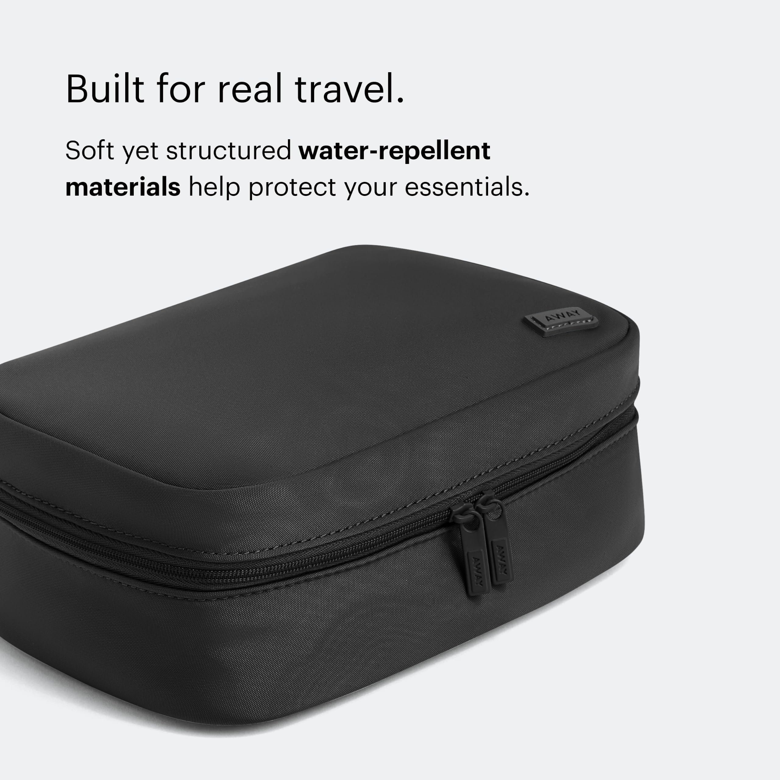 Away toiletry bag on travel tray illustrating neat packing benefit