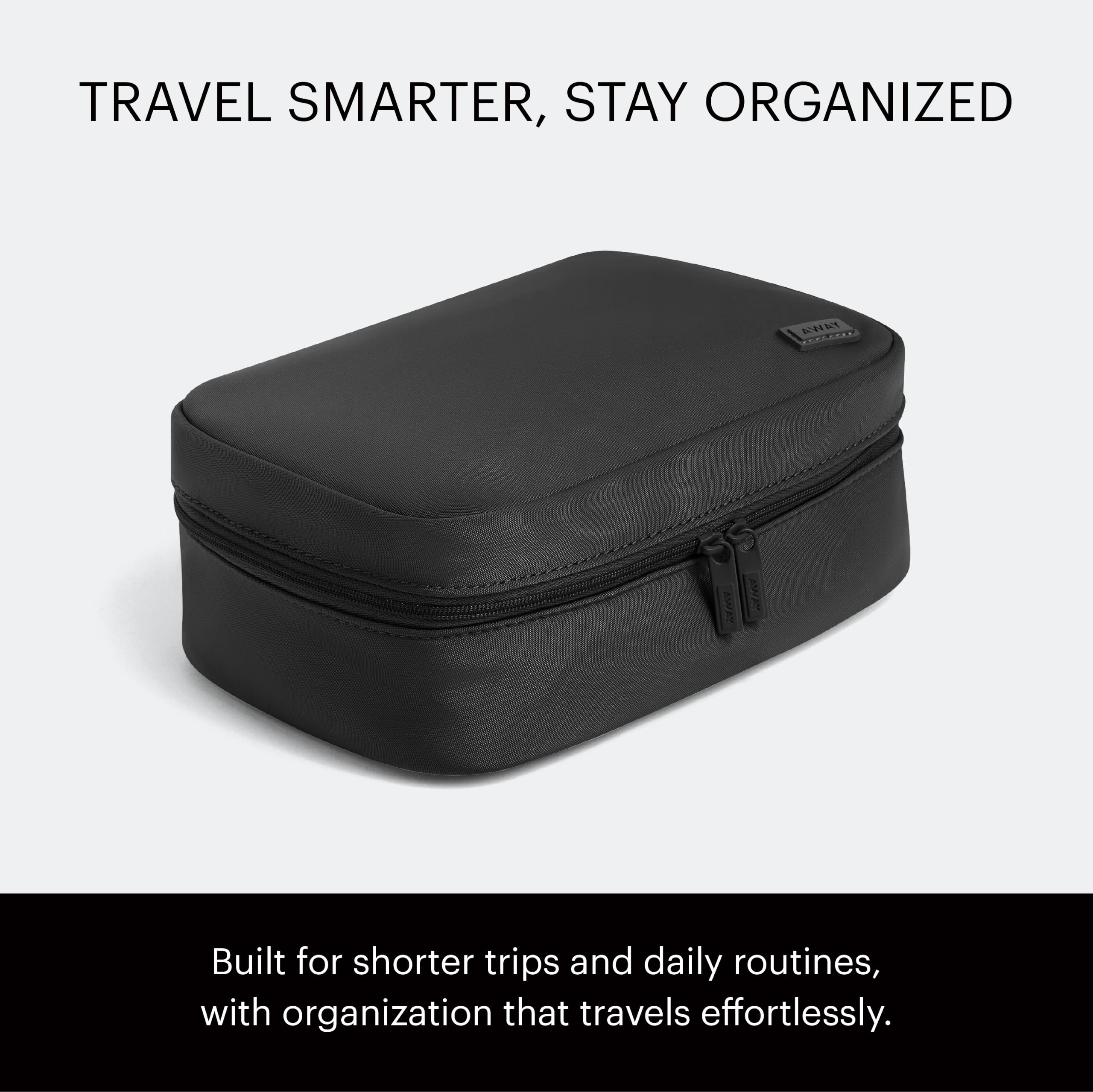 Away toiletry bag open with bottles visible for fast access benefit