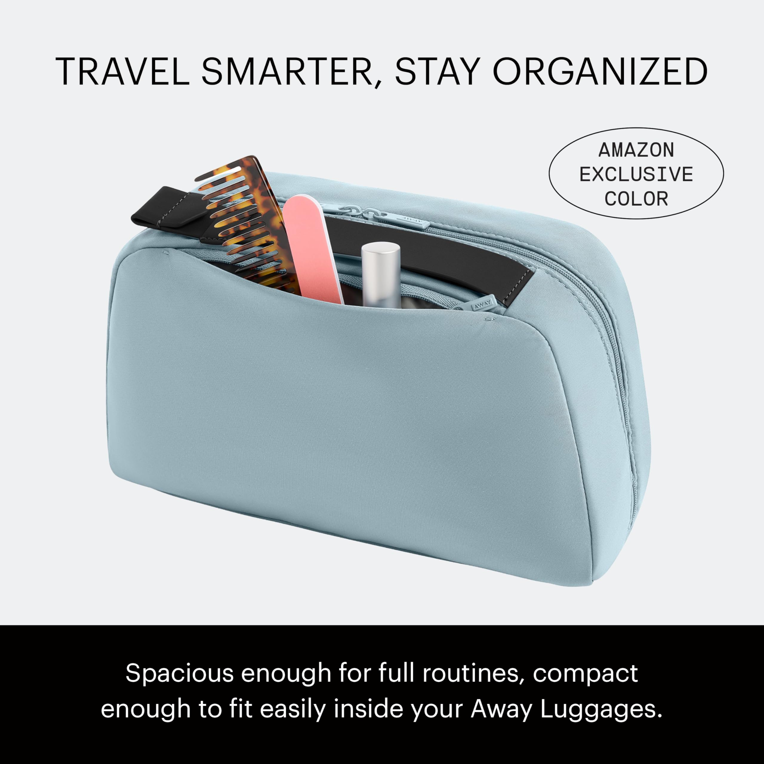 Away toiletry bag clamshell open displaying full access and organized layout